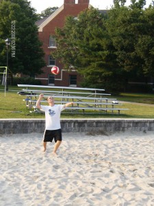 person serving a volleyball