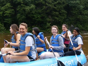 group of students rafting around the lake