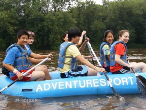 group students rafting in a lake